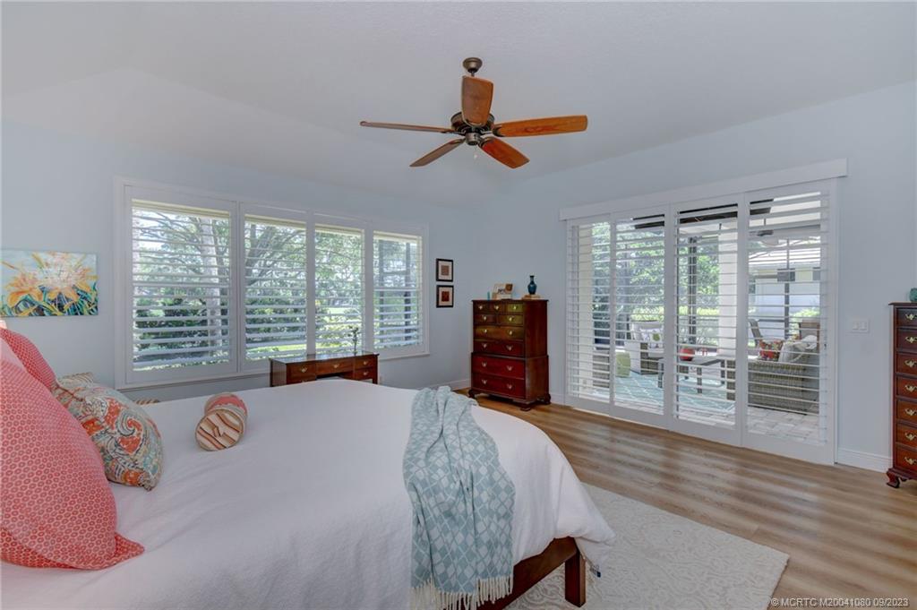 3531 Southeast Cambridge Drive Stuart, FL 34997 - Photo 24 of 44 a bed room with a bed and a large window
