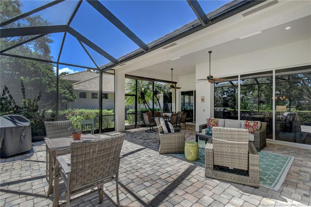 3531 Southeast Cambridge Drive Stuart, FL 34997 - Photo 34 of 44 a outdoor space with patio the couches and pool