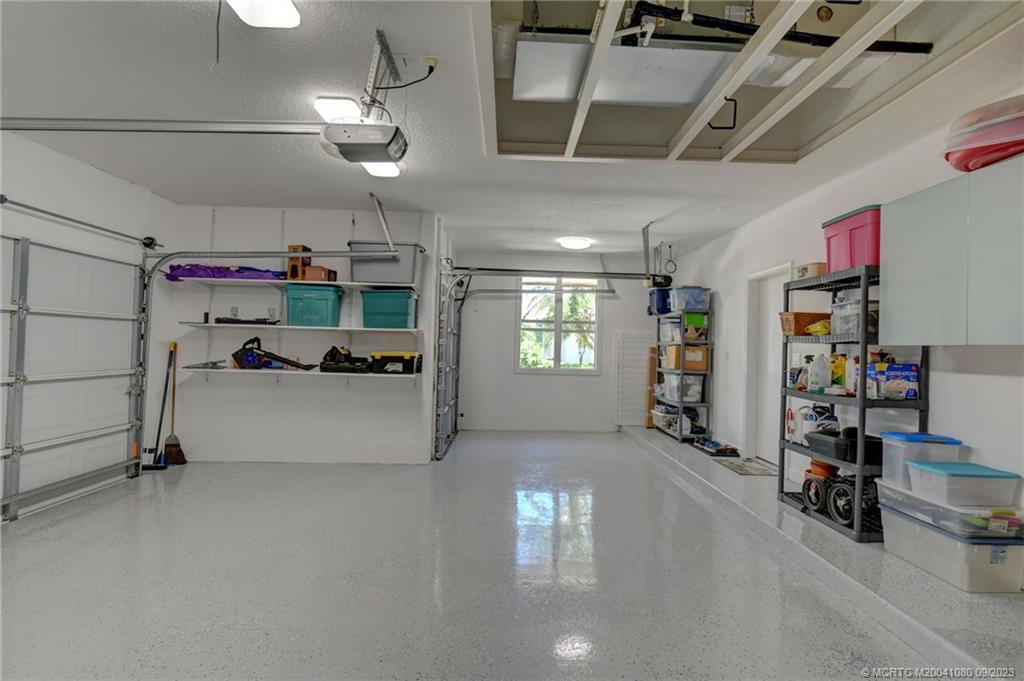 3531 Southeast Cambridge Drive Stuart, FL 34997 - Photo 38 of 44 a view of a garage with furniture and a window