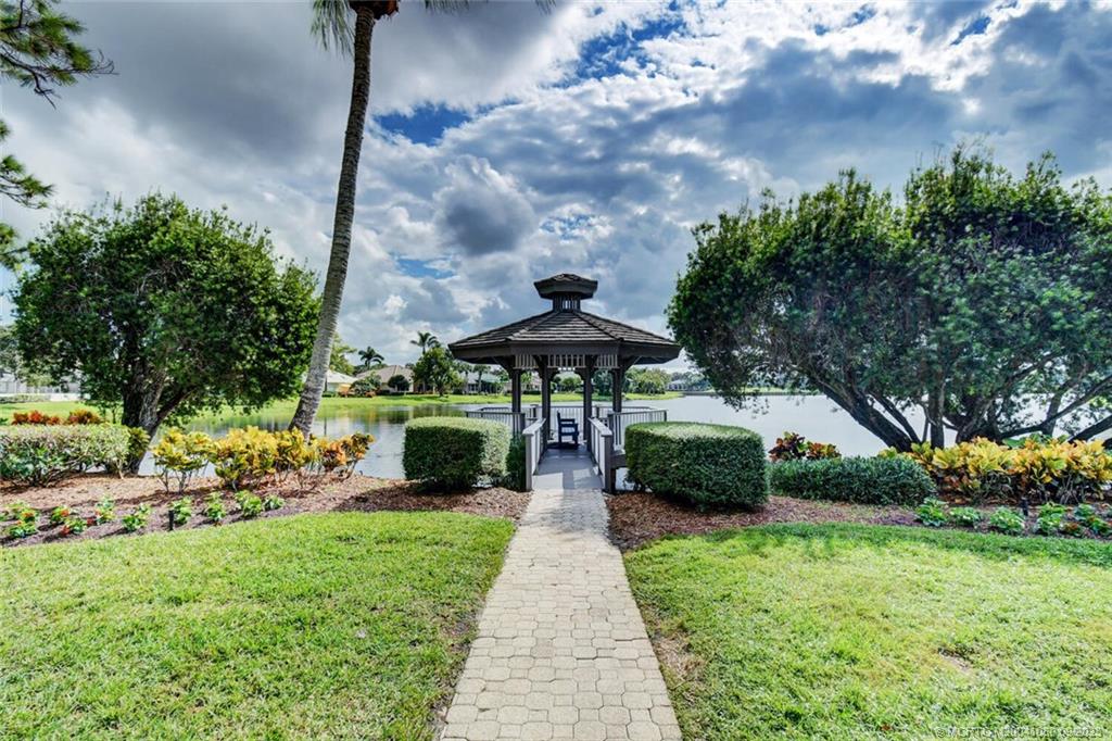 3531 Southeast Cambridge Drive Stuart, FL 34997 - Photo 39 of 44 a front view of a house with garden