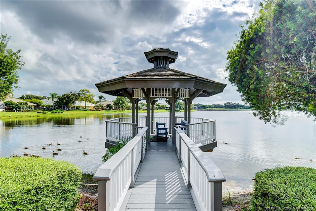 3531 Southeast Cambridge Drive Stuart, FL 34997 - Photo 40 of 44 a view of a lake from a balcony