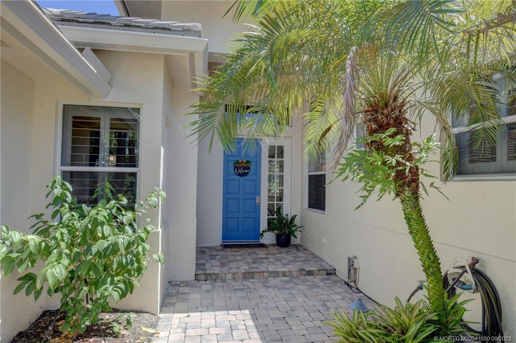 3531 Southeast Cambridge Drive Stuart, FL 34997 - Photo 5 of 44 a plant is in front of a house