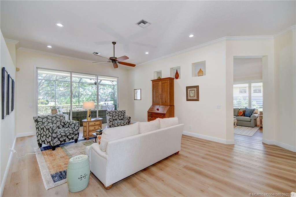 3531 Southeast Cambridge Drive Stuart, FL 34997 - Photo 6 of 44 a living room with furniture and a large window