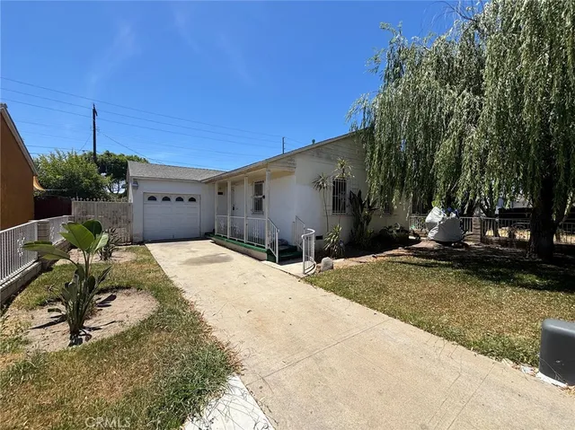 a backyard of a house with yard fire pit and outdoor seating