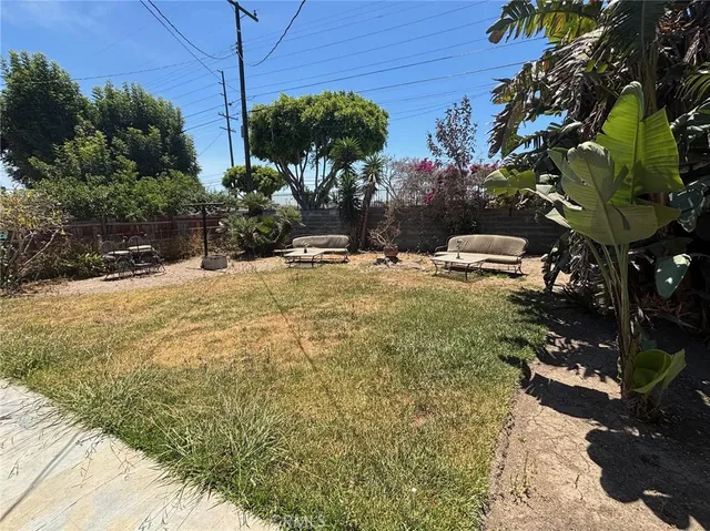 a view of a backyard of the house