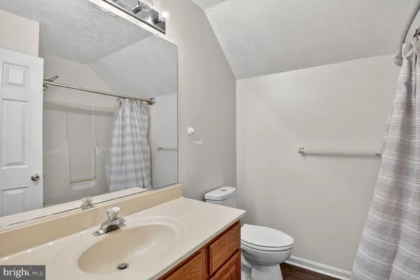 a bathroom with a sink and toilet