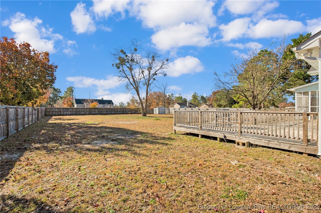 101 2 Hours Court Raeford, NC 28376 - Photo 26 of 30 a view of a yard with wooden fence