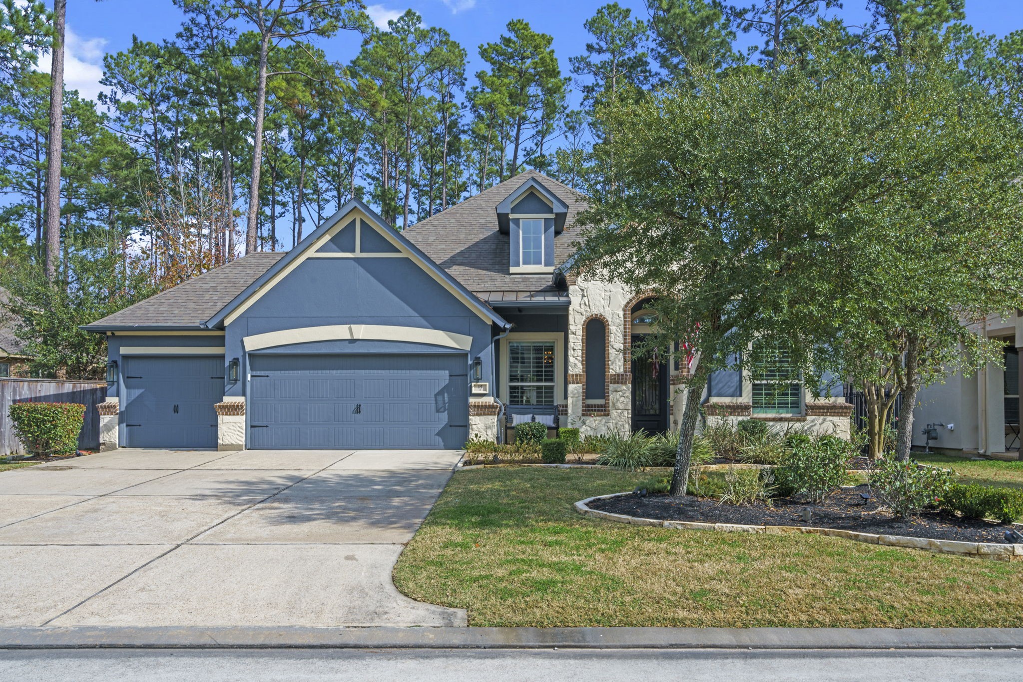 15 Inland Prairie Drive Tomball, TX 77375 - Photo 1 of 46 This charming home features a modern exterior with a spacious three-car garage, a well-maintained front yard, and mature trees. The home is welcoming with a manicured landscaping, offering great curb appeal in a serene neighborhood setting.