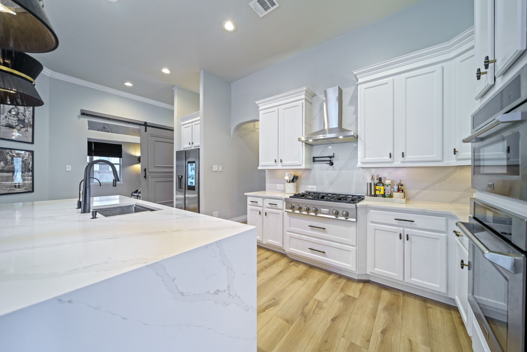 15 Inland Prairie Drive Tomball, TX 77375 - Photo 24 of 46 The kitchen has a gas stove top with pot filler and the media room/game room adjacent.