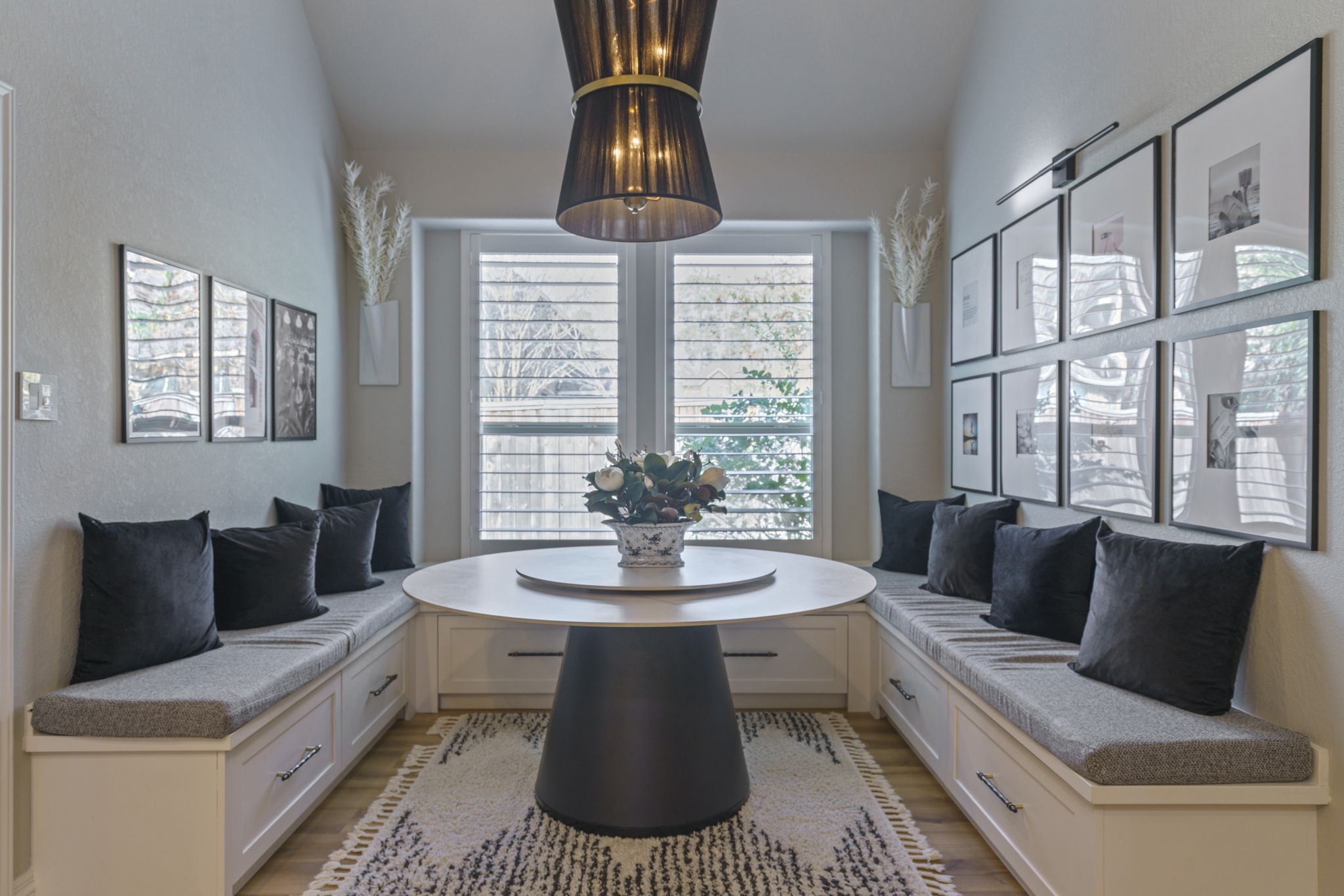 15 Inland Prairie Drive Tomball, TX 77375 - Photo 26 of 46 This cozy breakfast nook features built-in bench seating with storage with large windows, accented with the planation shutters, provide natural light.