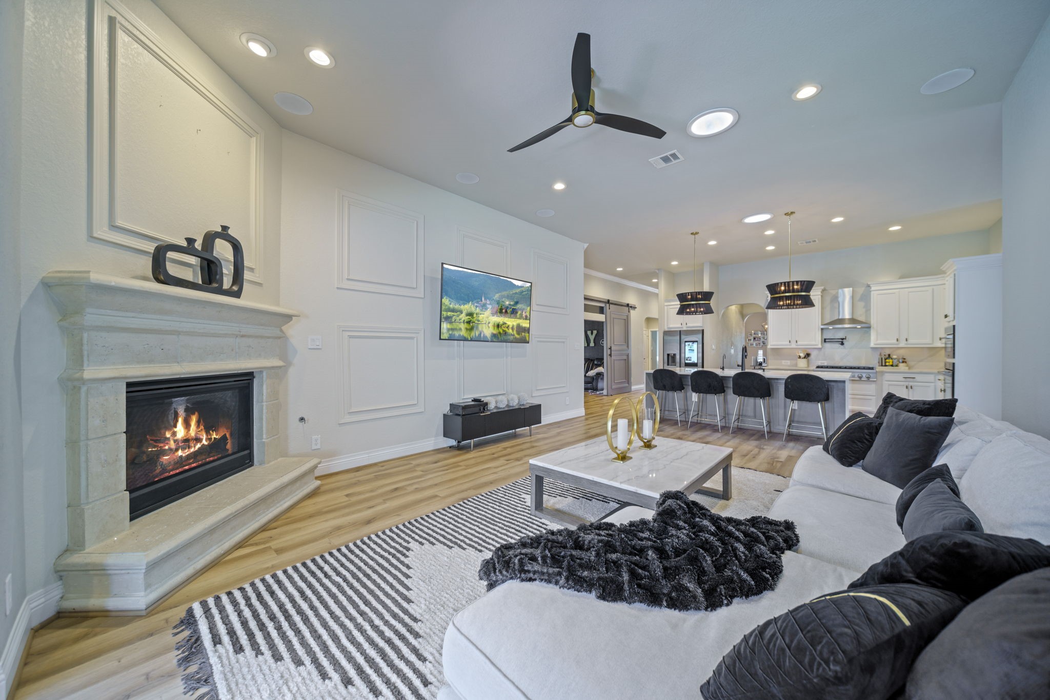 15 Inland Prairie Drive Tomball, TX 77375 - Photo 29 of 46 The living area leads to the kitchen with beautiful floors, tall ceilings and ample lighting.