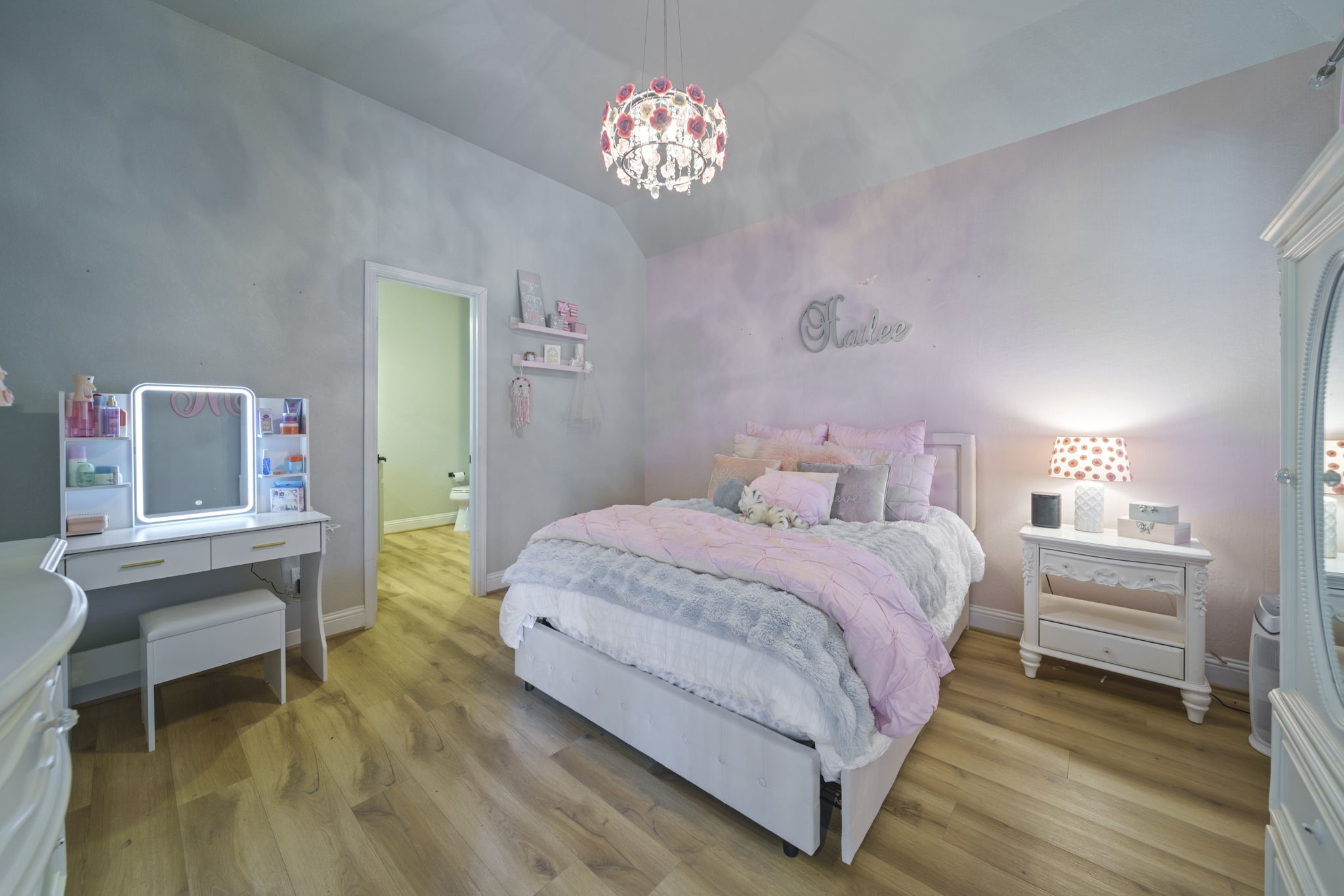 15 Inland Prairie Drive Tomball, TX 77375 - Photo 31 of 46 The 2nd bedroom has beautiful foors and and ensuite bathroom.