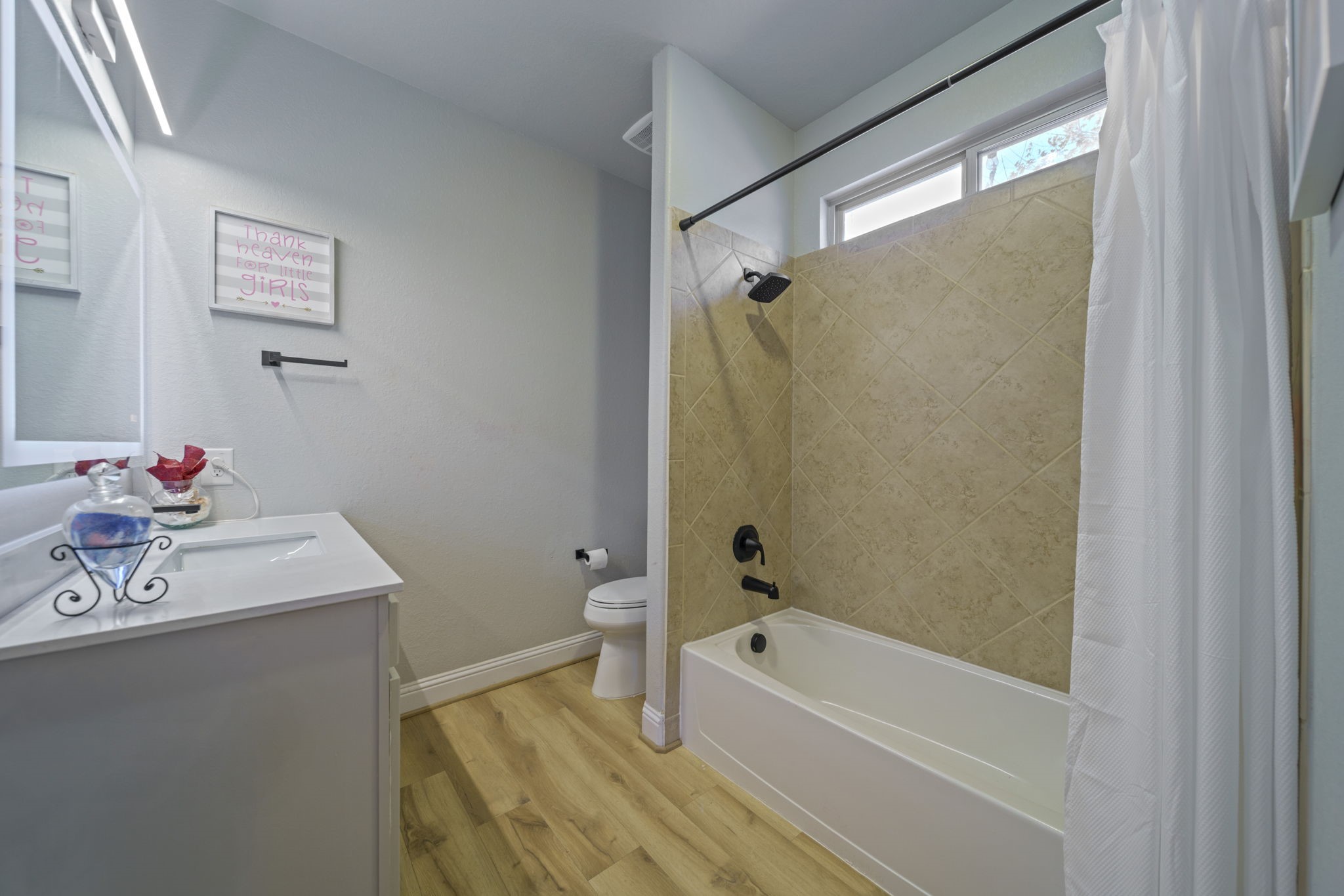 15 Inland Prairie Drive Tomball, TX 77375 - Photo 33 of 46 The ensuite for bedroom 2 has a bathtub/shower combo.