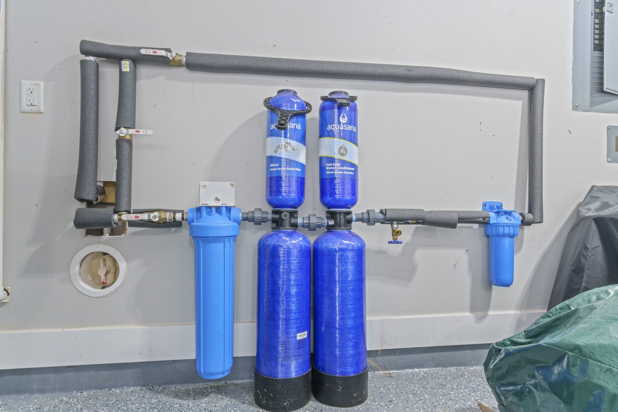 15 Inland Prairie Drive Tomball, TX 77375 - Photo 44 of 46 This home offers a home filtration system located in the 3-car garage that has an epoxy coating.