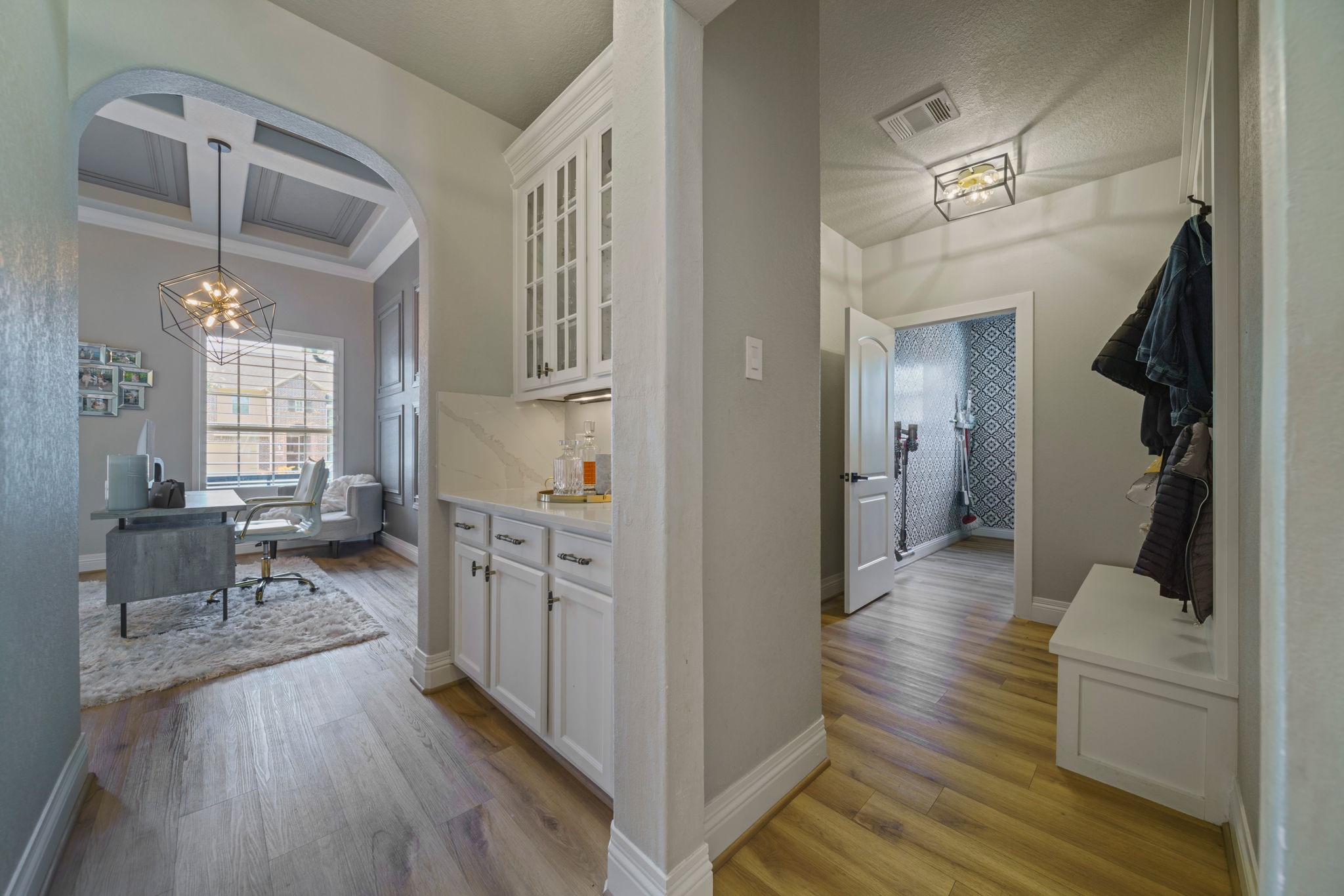15 Inland Prairie Drive Tomball, TX 77375 - Photo 9 of 46 Off the butlers pantry is a hallway leading to the laundry room with a mudroom.