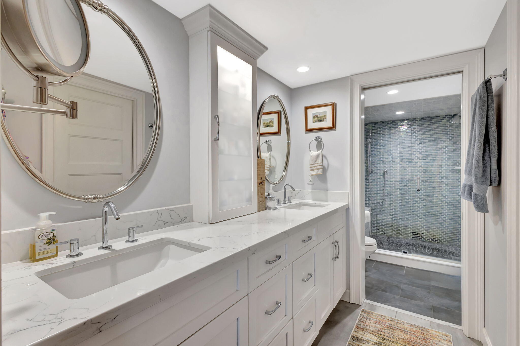 16910 Bay Street, Unit E503 Jupiter, FL 33477 - Photo 11 of 33 a bathroom with a double vanity sink mirror and bathtub