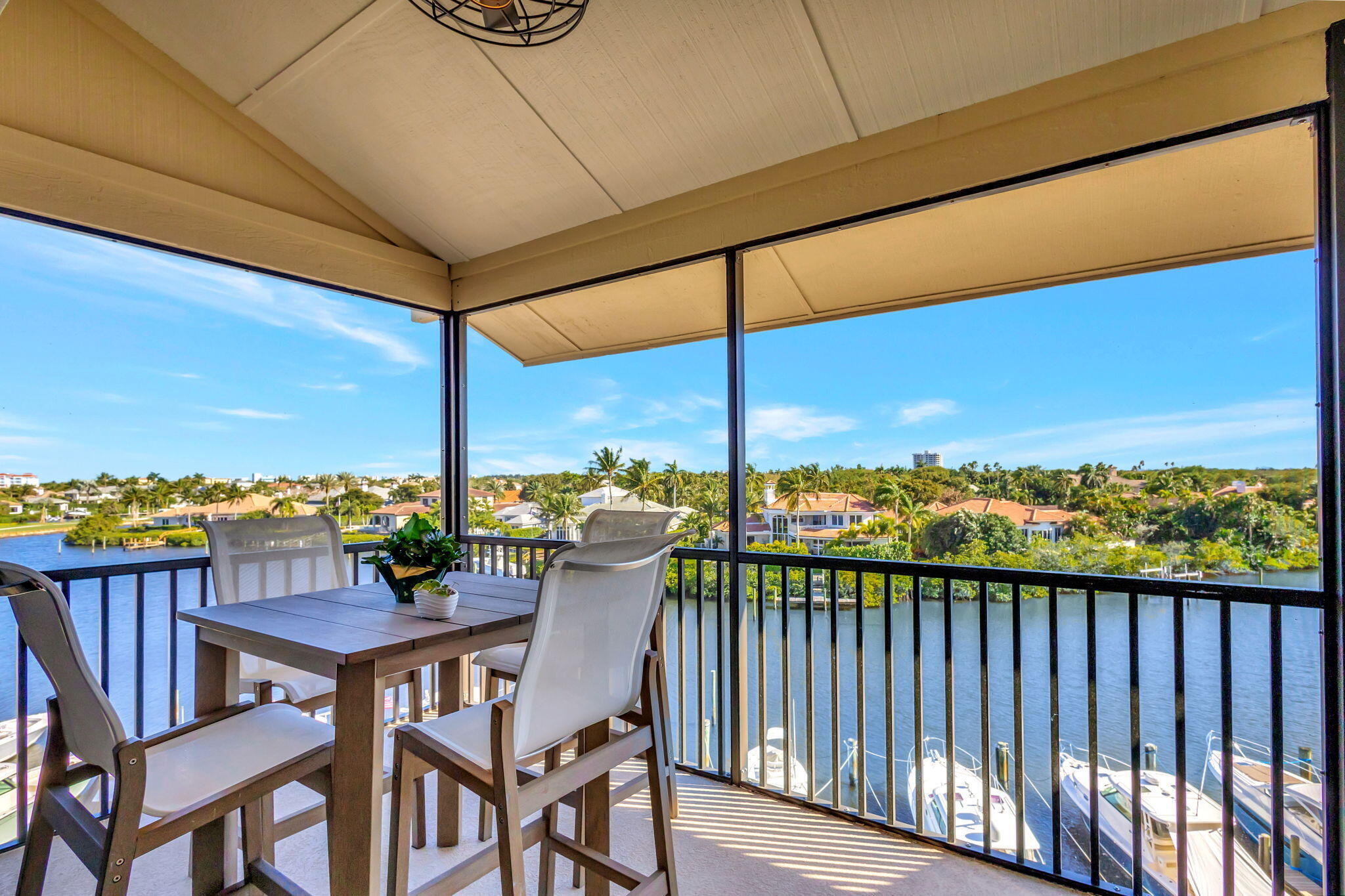 16910 Bay Street, Unit E503 Jupiter, FL 33477 - Photo 33 of 33 a view of a chairs and table in the balcony