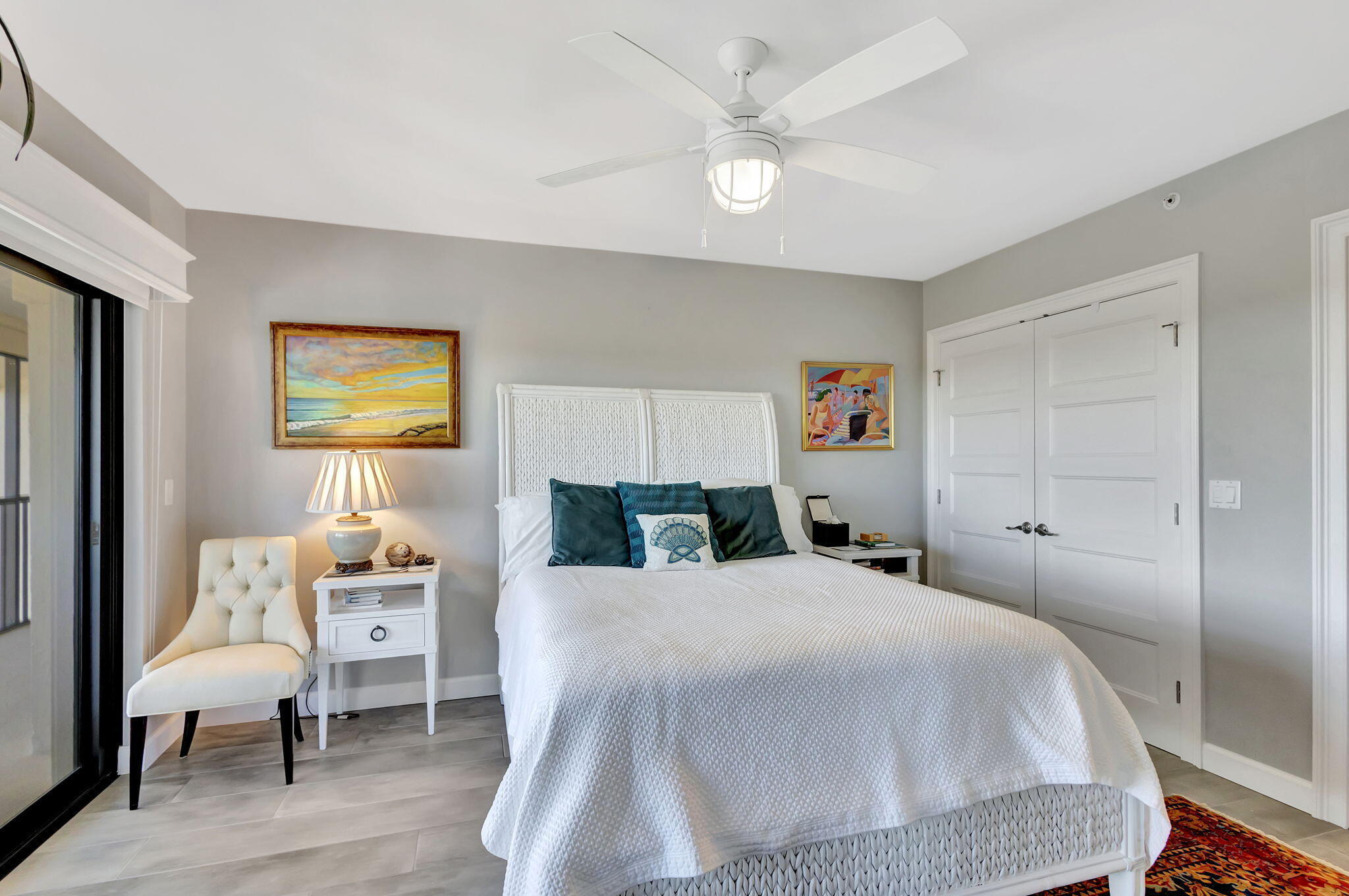 16910 Bay Street, Unit E503 Jupiter, FL 33477 - Photo 6 of 33 a bedroom with a bed and wooden floor