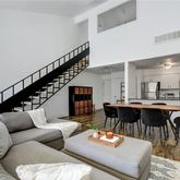 a view of a balcony with residential houses