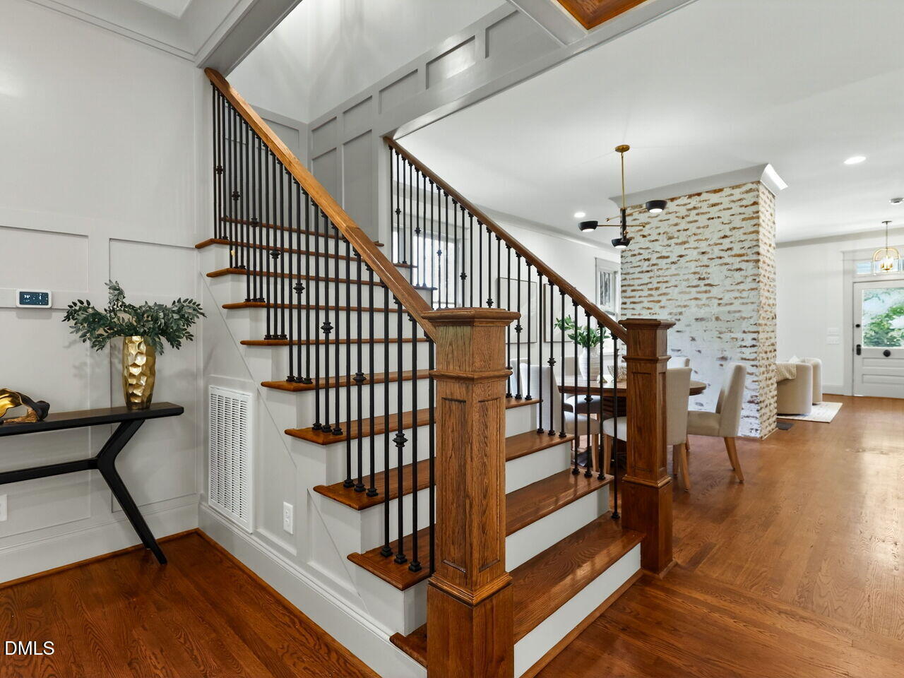 504 Tilden Street Raleigh, NC 27605 - Photo 37 of 58 a view of entryway with wooden floor and stairs