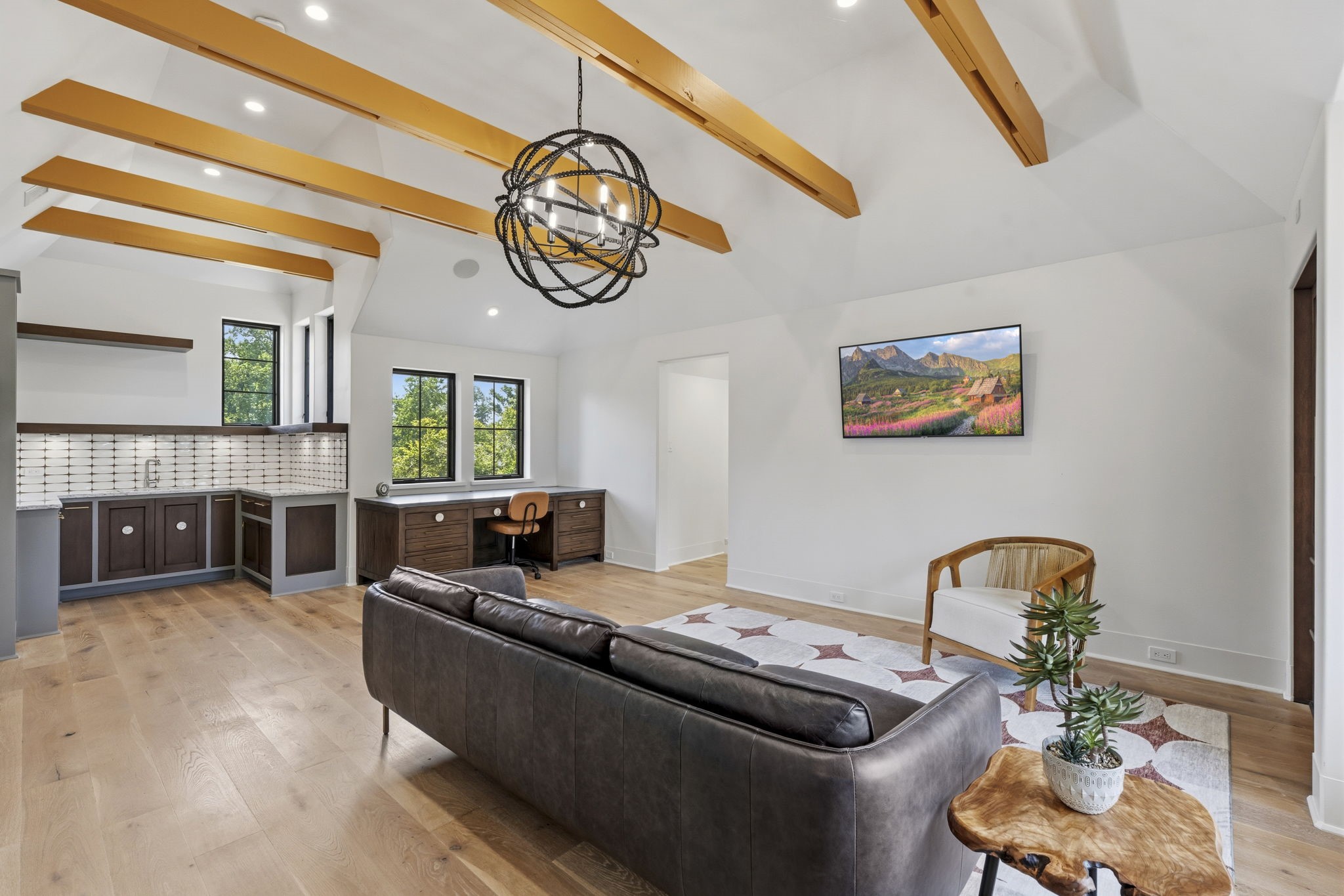 27006 Star Gazer Way Spring, TX 77386 - Photo 42 of 50 A versatile upstairs retreat that can serve as a bedroom, craft room, or creative workspace, featuring built-in storage, a dedicated desk area, and a private sink for added convenience.