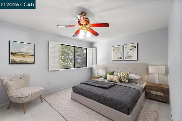 a bedroom with a large bed and a couch