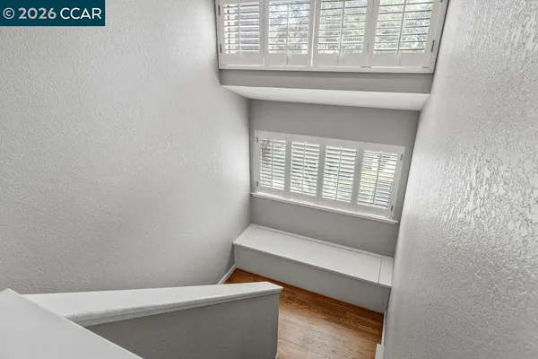 a bathroom with a bathtub and window