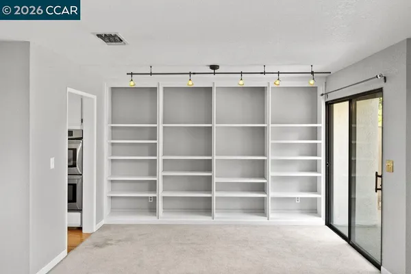 a view of an empty walk in closet