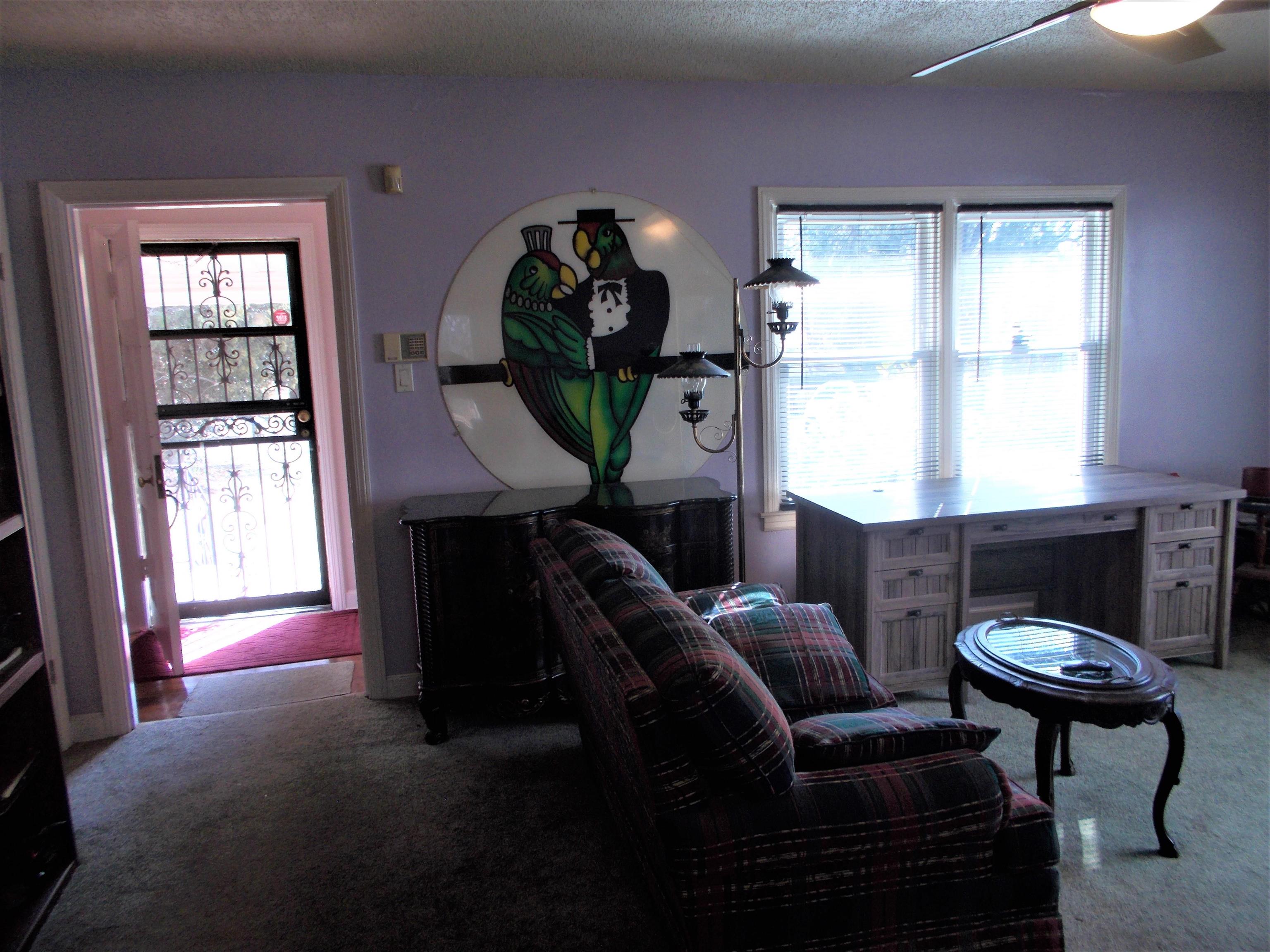 954 North Ball Road Memphis, TN 38106 - Photo 3 of 25 a living room with furniture a window and a chandelier