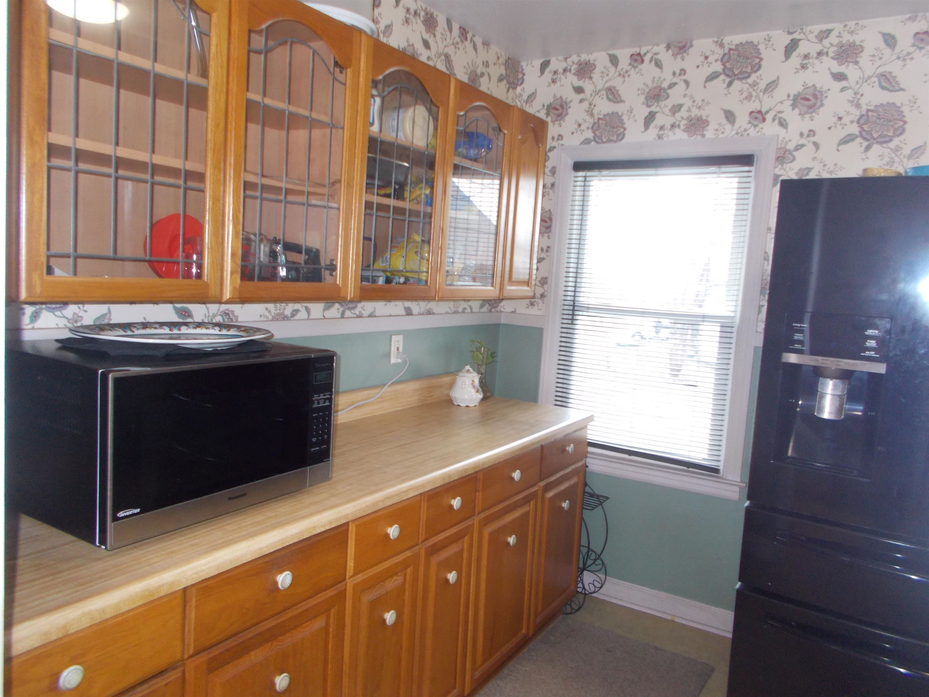 954 North Ball Road Memphis, TN 38106 - Photo 5 of 25 a spacious bathroom with a granite countertop sink and a window