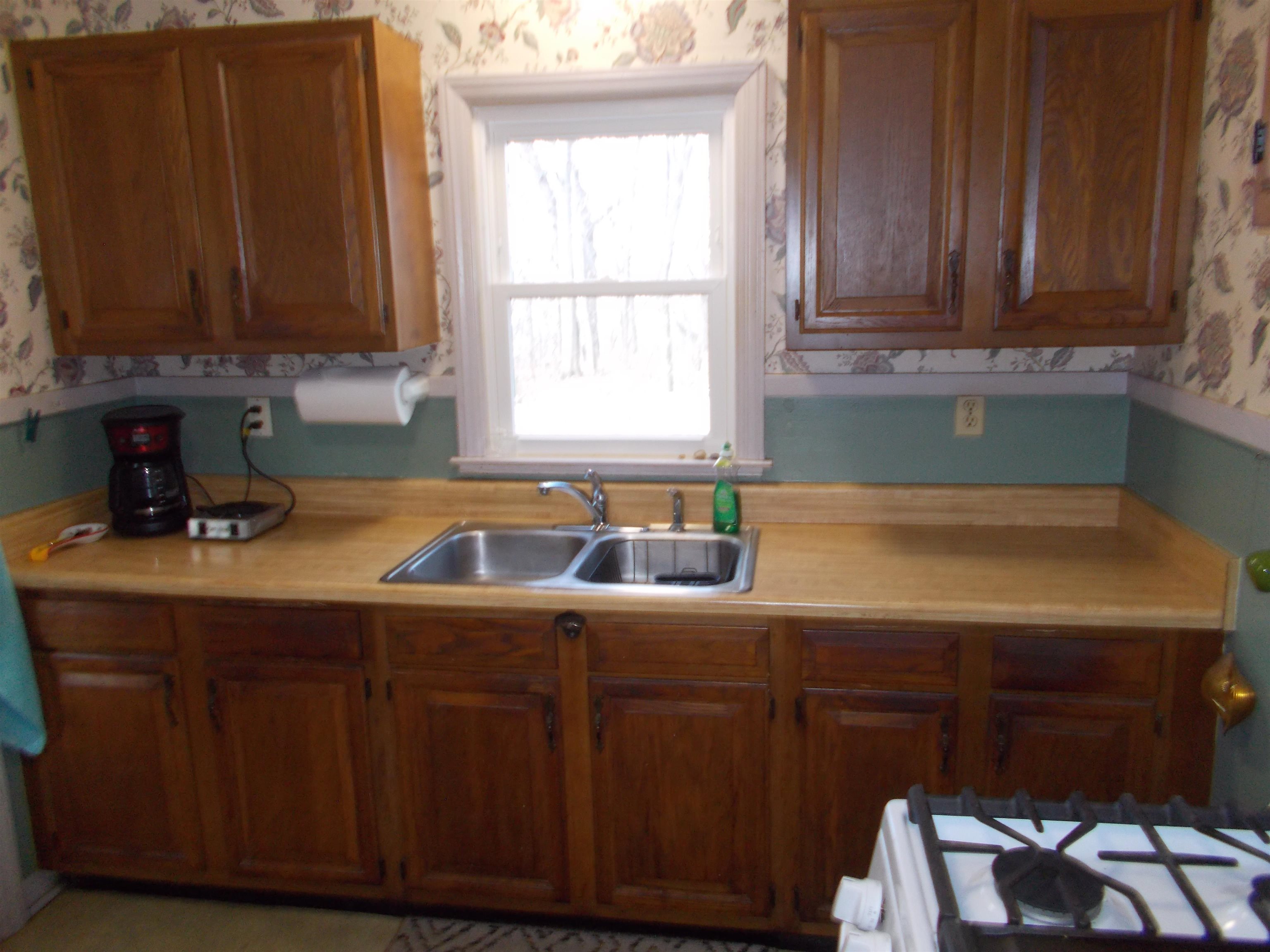 954 North Ball Road Memphis, TN 38106 - Photo 6 of 25 a kitchen with a sink cabinets and window