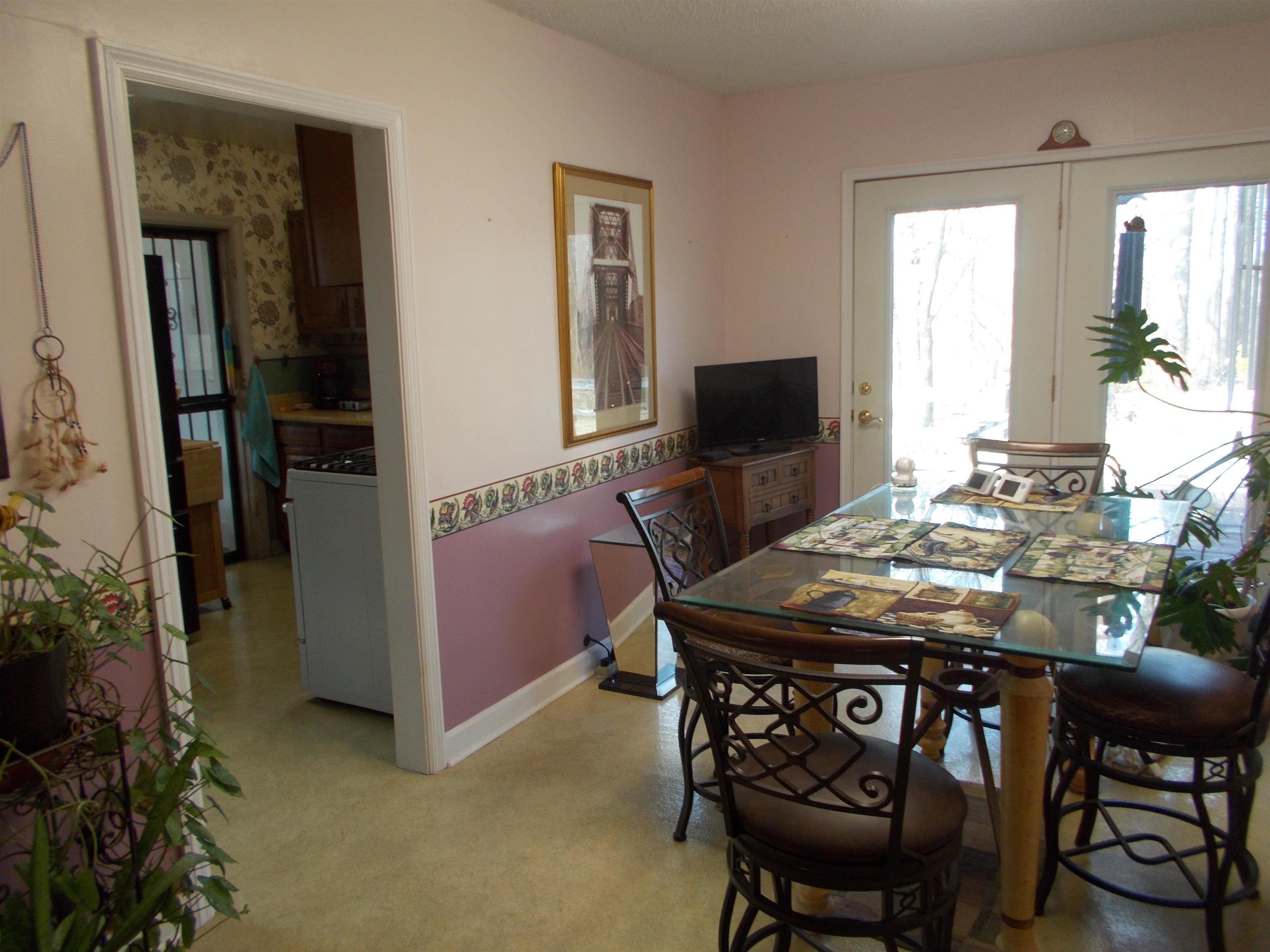 954 North Ball Road Memphis, TN 38106 - Photo 10 of 25 a view of a dining room with furniture and a chandelier
