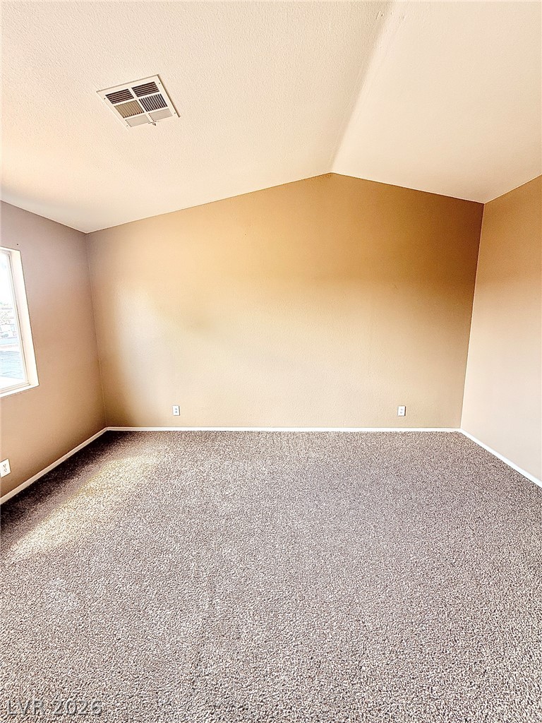 4313 Ranch Foreman Road North Las Vegas, NV 89032 - Photo 12 of 27 Plush carpeting and vaulted ceilings enhance this comfortable living space.