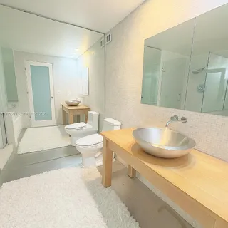 a bedroom with a bed and a fireplace