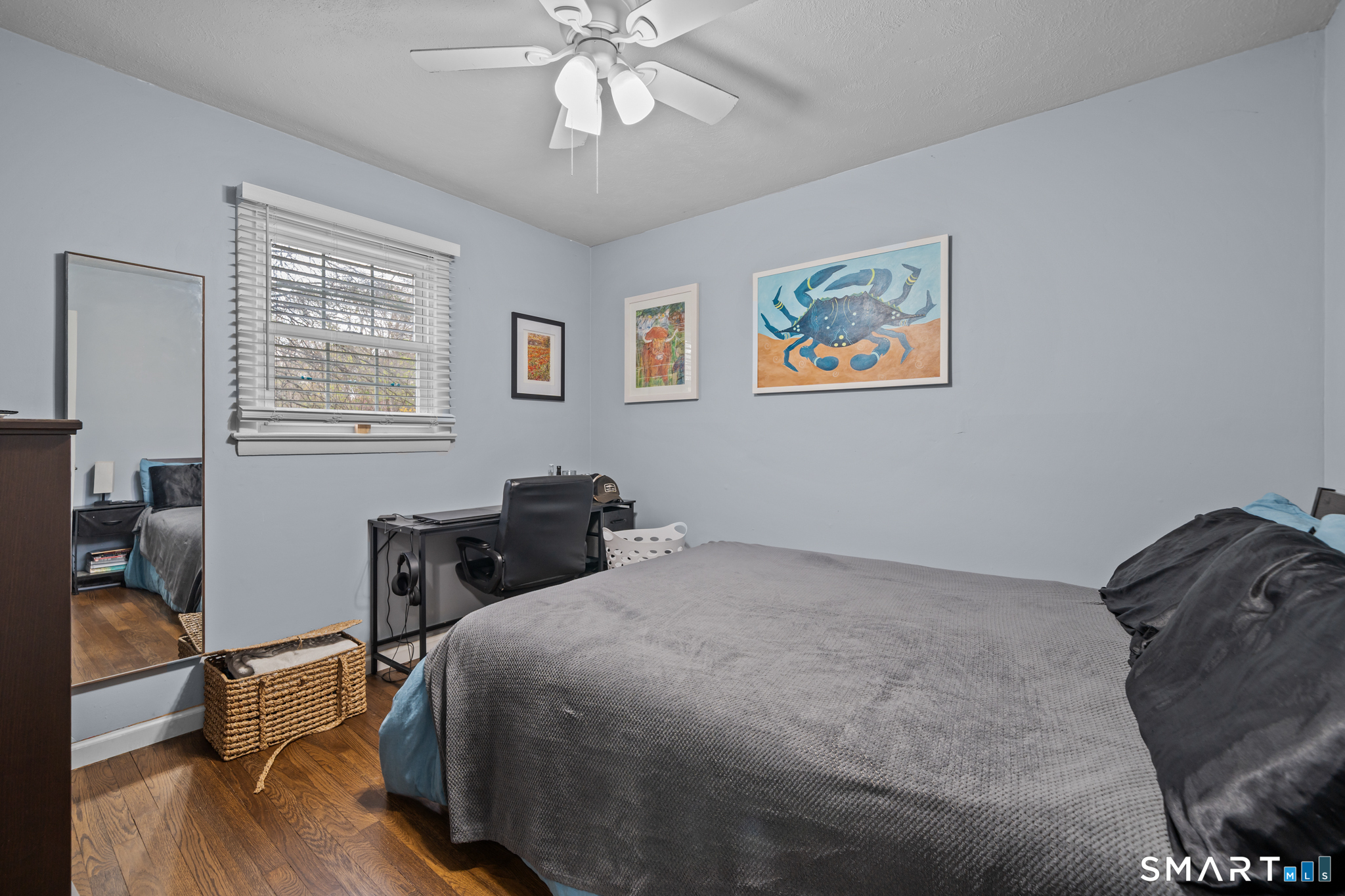 12 Lake Street Ledyard, CT 06339 - Photo 11 of 19 a bedroom with a bed and a chandelier
