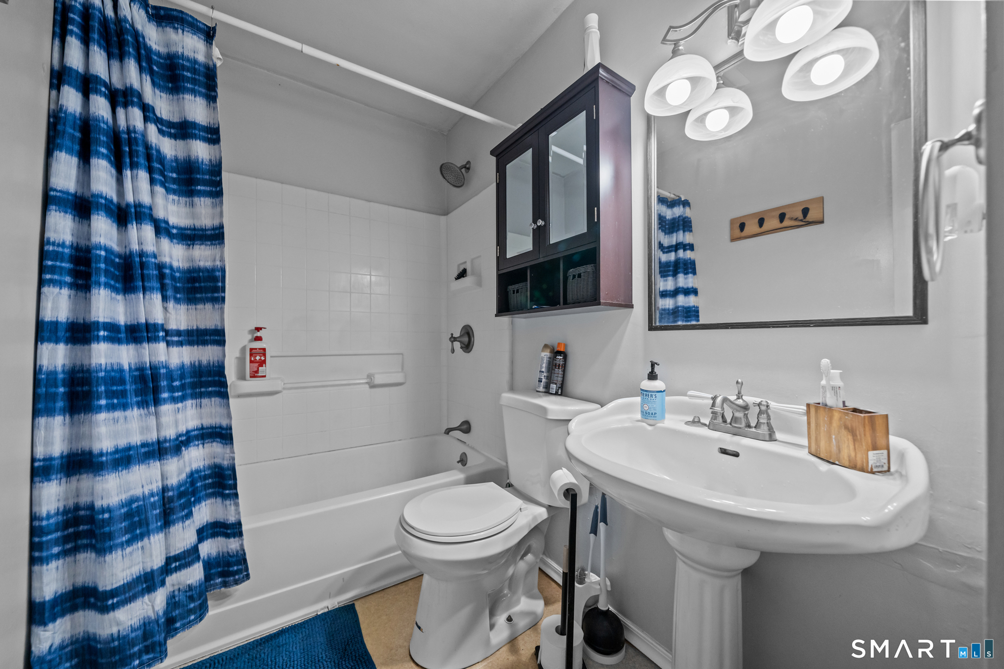 12 Lake Street Ledyard, CT 06339 - Photo 15 of 19 a bathroom with a sink a toilet and shower