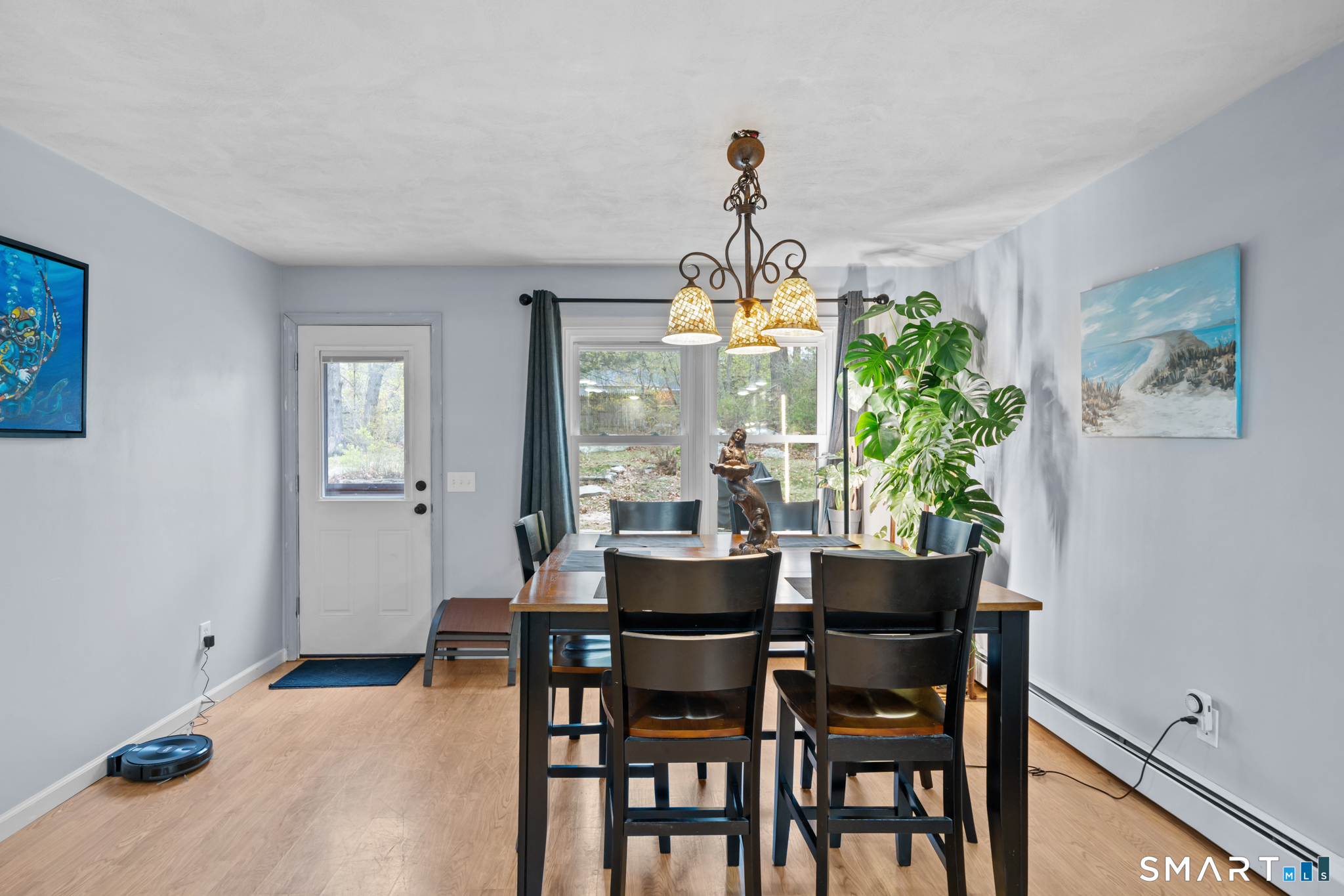 12 Lake Street Ledyard, CT 06339 - Photo 7 of 19 a view of a dining room with furniture and chandelier