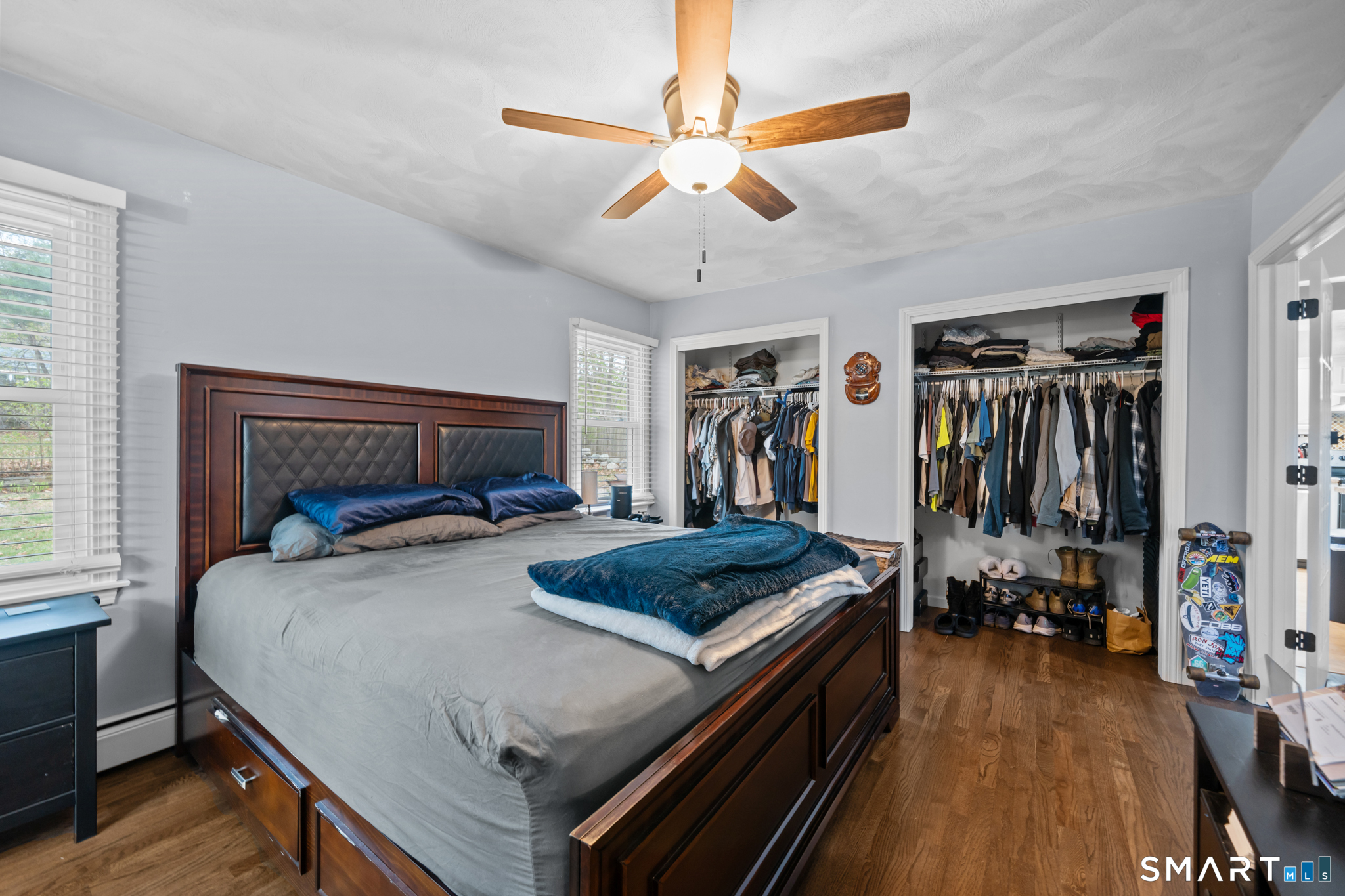 12 Lake Street Ledyard, CT 06339 - Photo 9 of 19 a bedroom with a bed and a walk in closet