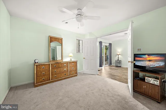 a view of a kitchen with a sink and a refrigerator