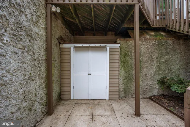a view of a wooden door with a backyard