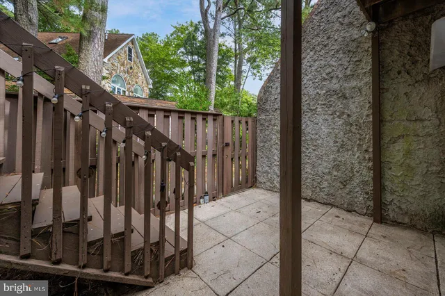 a view of a balcony with a table and chairs