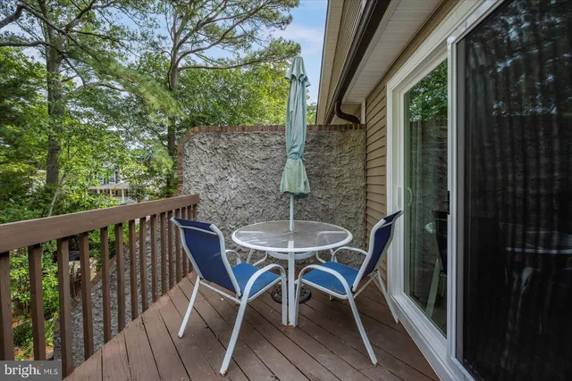 a view of balcony with wooden floor