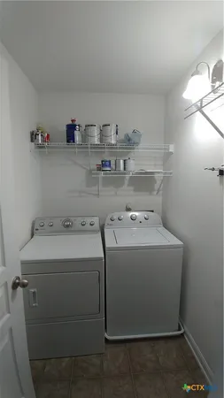 a utility room with washer and dryer