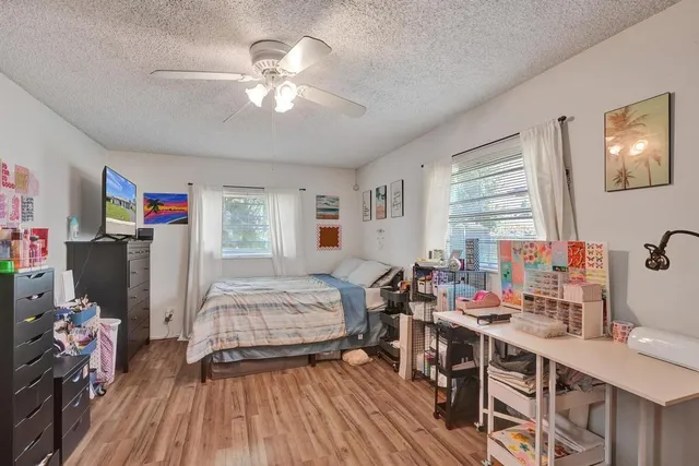 a view of a livingroom with furniture and hardwood floor