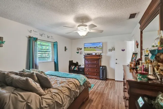 a bathroom with a sink mirror and vanity
