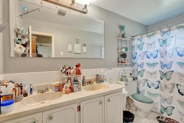 a kitchen with sink and cabinets