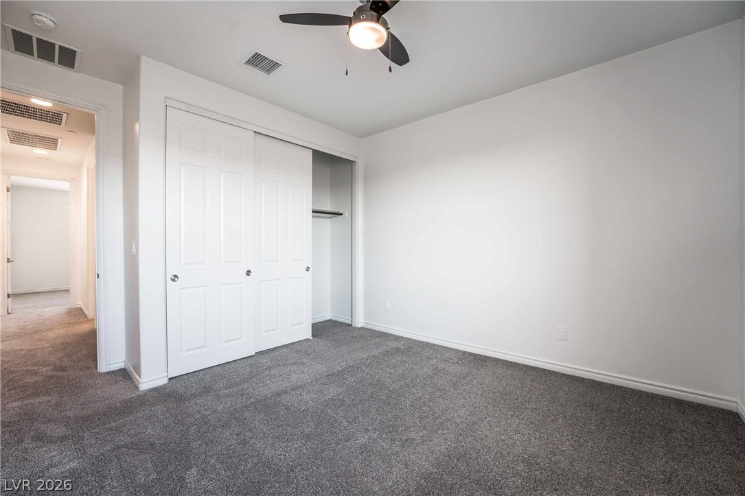 2787 Athens Ridge Drive Henderson, NV 89052 - Photo 24 of 31 A well-lit bedroom provides comfortable living with soft carpeting and convenient closet space.