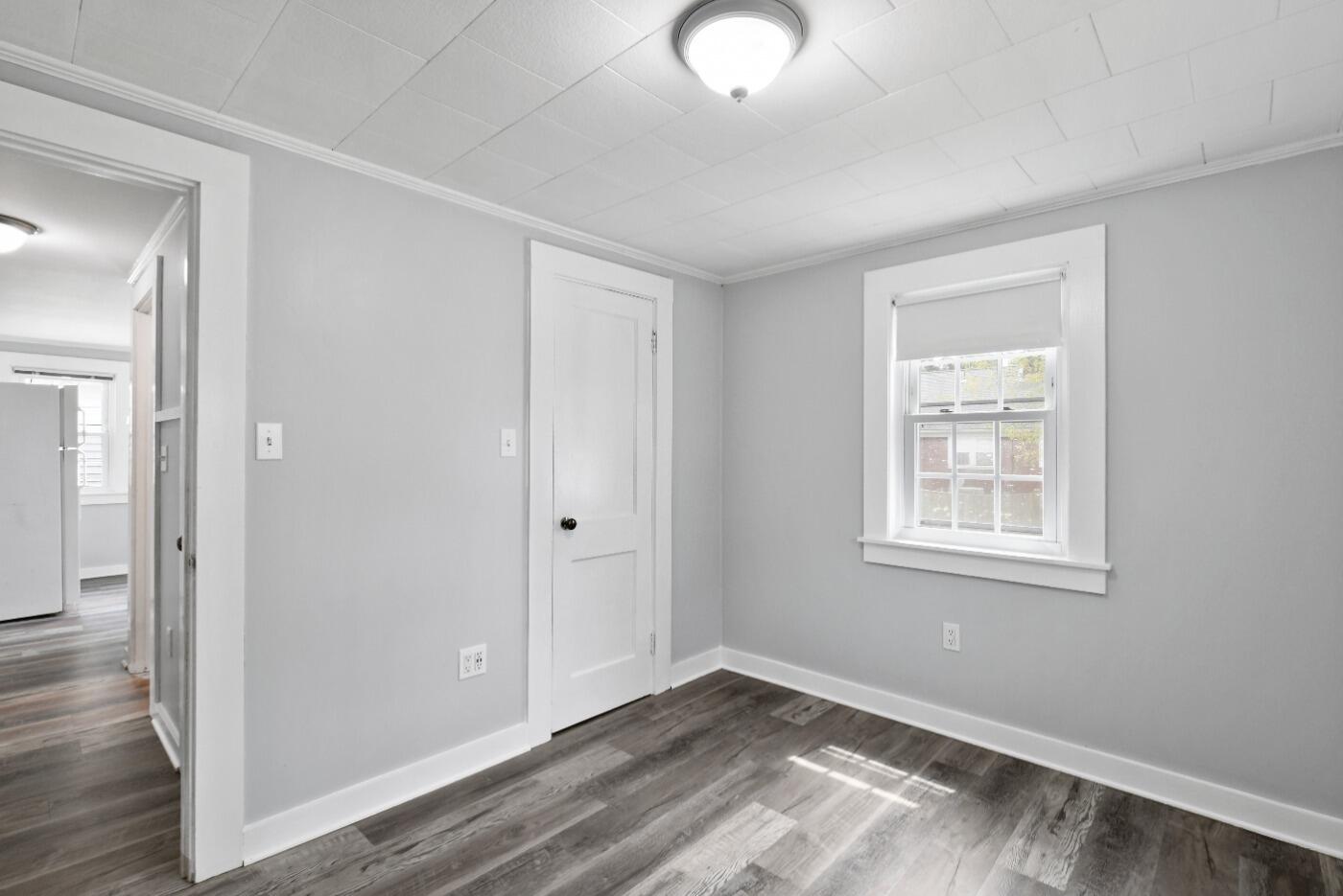 1 Gilbert Road Dennis Port, MA 02639 - Photo 21 of 27 a view of an empty room with wooden floor and a window