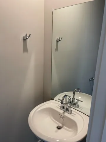 a bathroom with a sink and mirror