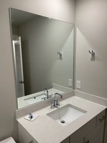 a bathroom with a sink and a mirror